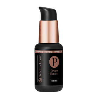 Black peace serum bottle with a copper cap on a white background